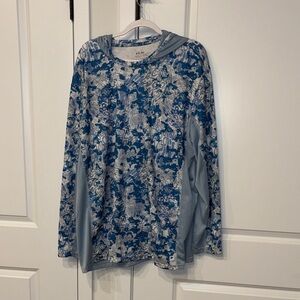 Blue and white HUK fishing shirt